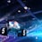 A large indoor arena is equipped with advanced lighting and audio systems. Suspended above the space are numerous digital displays showcasing numbers. The environment is filled with blue illumination and spotlights creating a vibrant atmosphere.